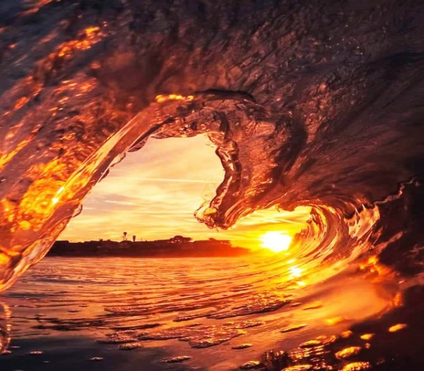 Heart made up of water with orange glowing lights representing self love.