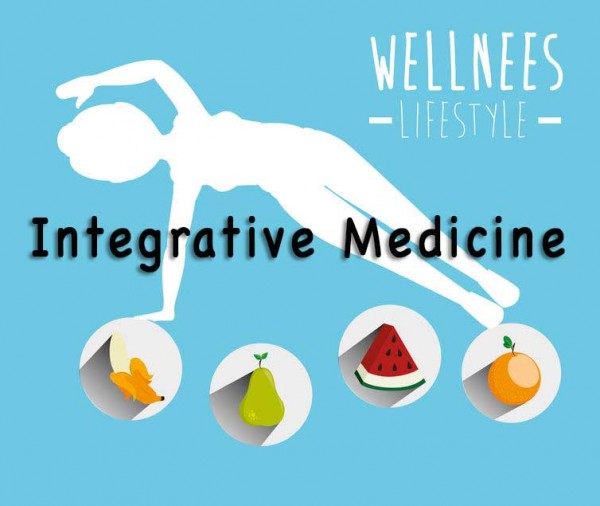 An image of a person doing yoga and some fruits and vegetables beneath to discuss what integrative medicine is.
