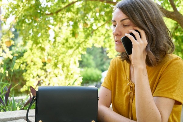 A person doing a phone screening to evaluate what therapist is the best match for her.