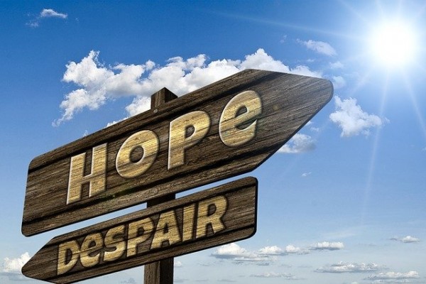 A sign with the words "hope" and "despair" to talk about how our society doesn't support people who are different.